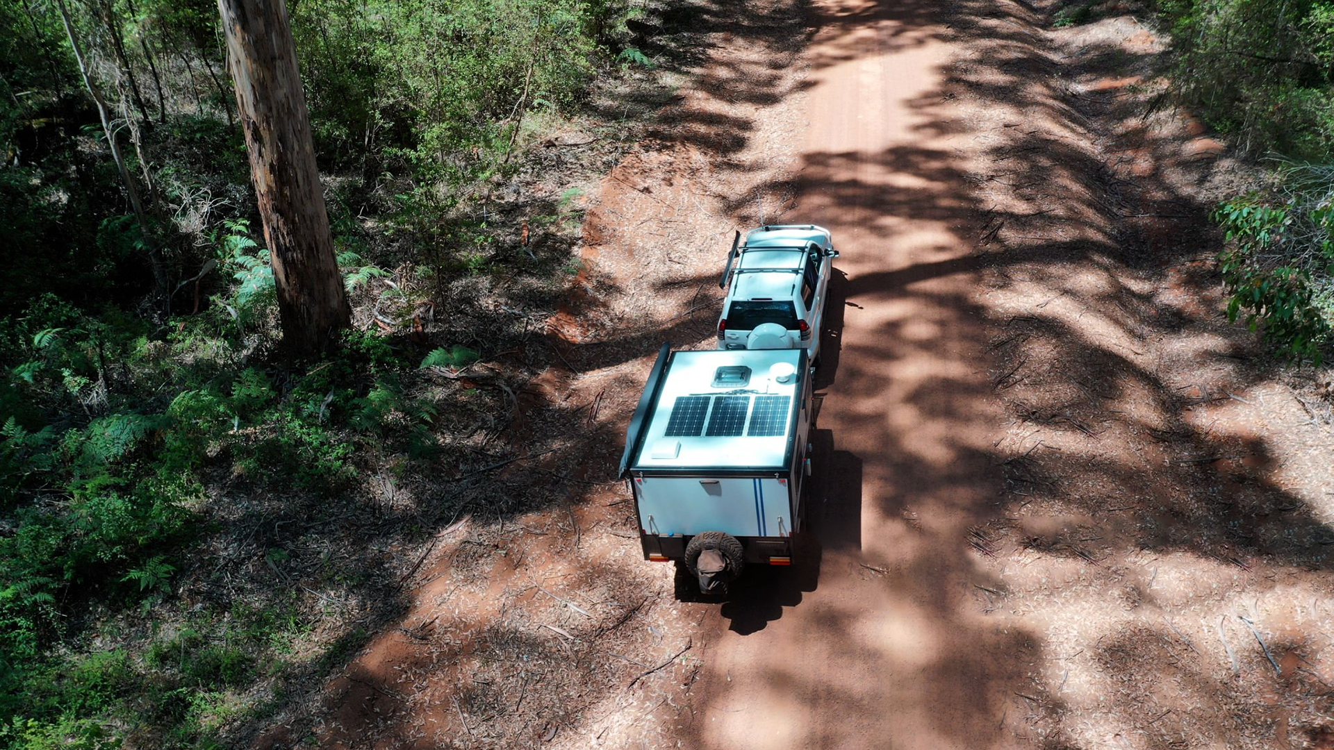 Off-grid solar panel system on caravan rooftop with battery and inverter
