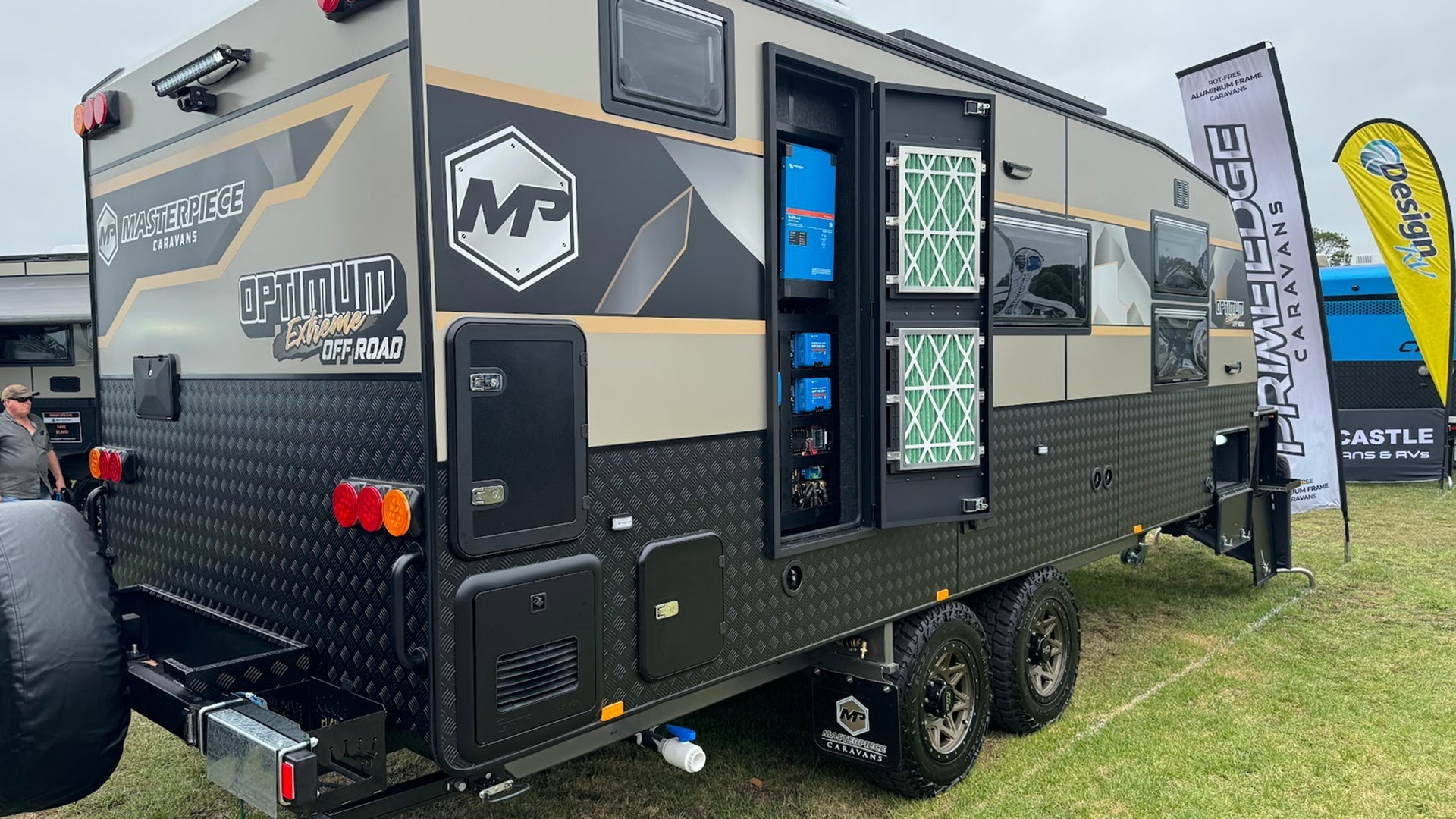 Caravan off-grid electrical system installation with inverter and lithium battery setup